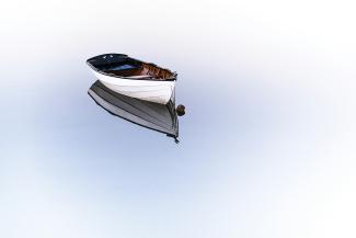white boat on body of water by Osman Rana courtesy of Unsplash.