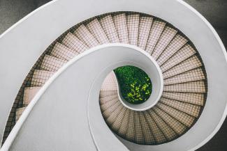 white and brown concrete spiral stairs by Dan Freeman courtesy of Unsplash.