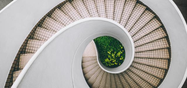 white and brown concrete spiral stairs by Dan Freeman courtesy of Unsplash.